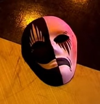 ateez enter the place with a van and take down the security, they take the controlthe mask they wear is the comedy-tragedy mask, it represents the emotions in theatre