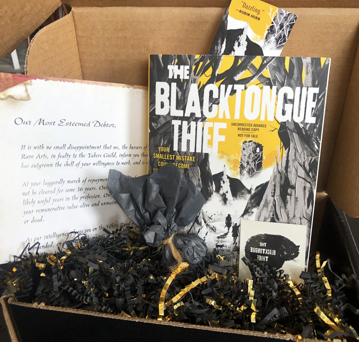 Happy Friday! We're celebrating by giving one lucky person the chance to win our #TheBlacktongueThief influencer box. Just follow us and RT this post for the chance to win:
 
-1 galley
-2 tattoos
-2 skull dice
-1 bookmark 
-1 letter 

#BlacktongueThiefBoxSweeps @Buehlmeister