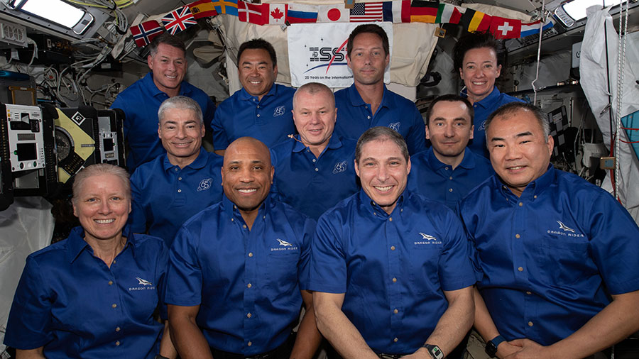 The 11-member crew aboard the station is actually a combination of three different crews. The four Space Crew-2 astronauts are in the back row. The three-person crew of the Soyuz MS-18 crew ship is in the middle row. In the front row, is the SpaceX Crew-1 foursome.