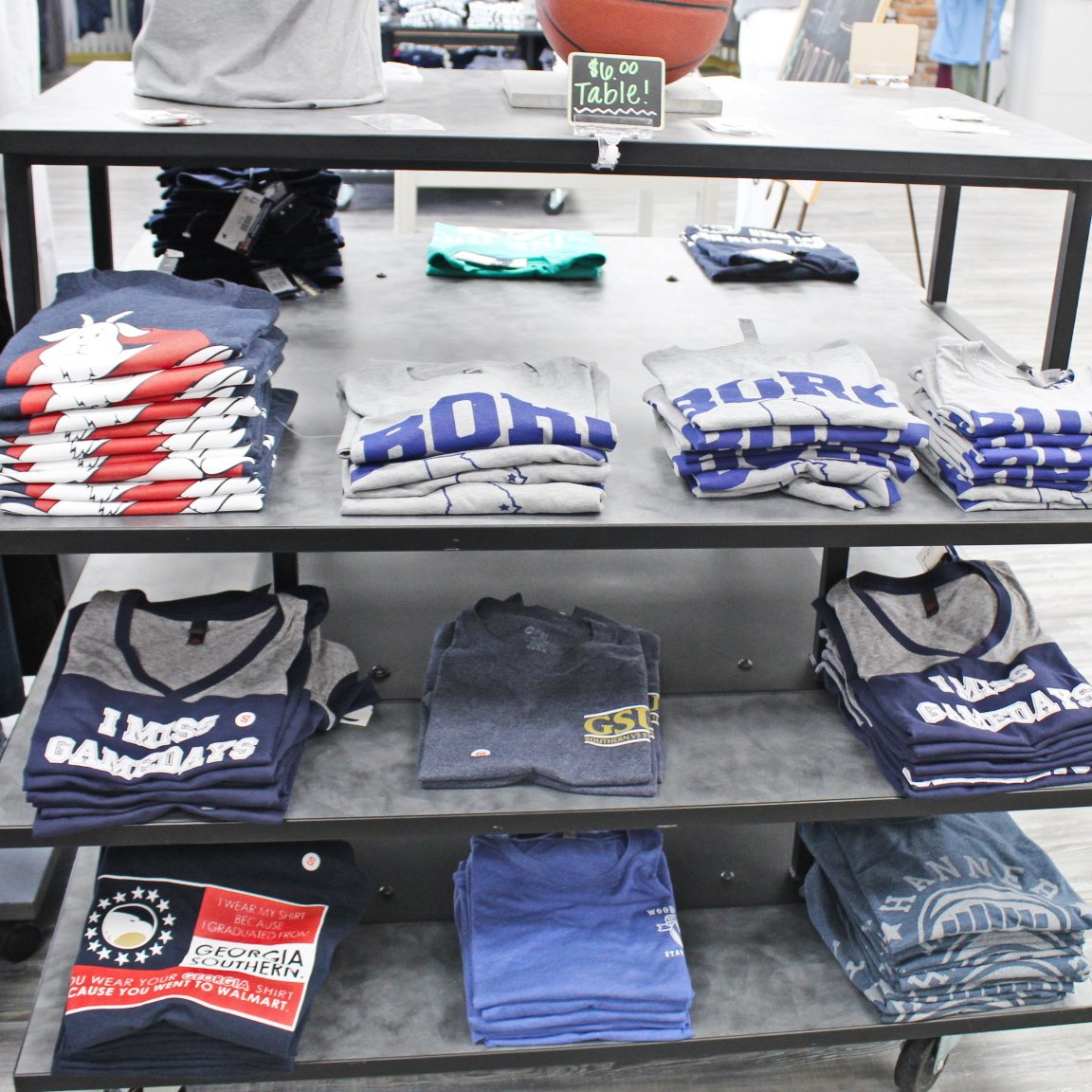 TrueGSU's tweet photo. If you're in the market for a bargain, come and check out our $6 table. The only thing better that #GSgear is #GS gear on sale! 🦅

#GATA #GeorgiaSouthern #Sale #football #CollegeFootball #Collegesports #borostrong #statesboro #borostyle #sunbeltconference #sunbelt https://t.co/QSMVkDh1CS
