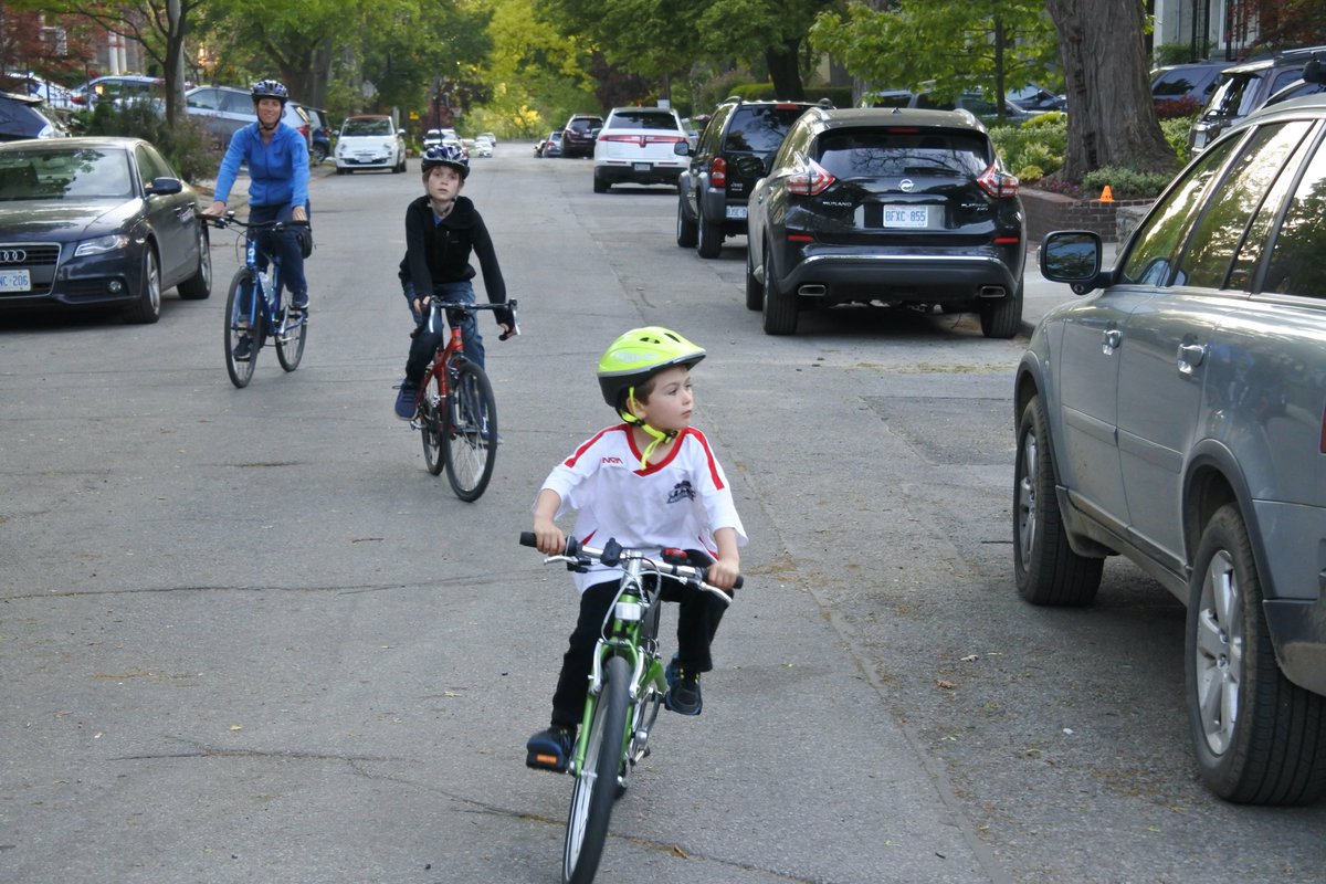 Parents can practice scanning for traffic while shepherding the kids safely. See which style of group riding you like - for us, kids in front & parent bringing up the rear feels best. Other families might prefer to have kids next to the curb or on the sidewalk, parent alongside.