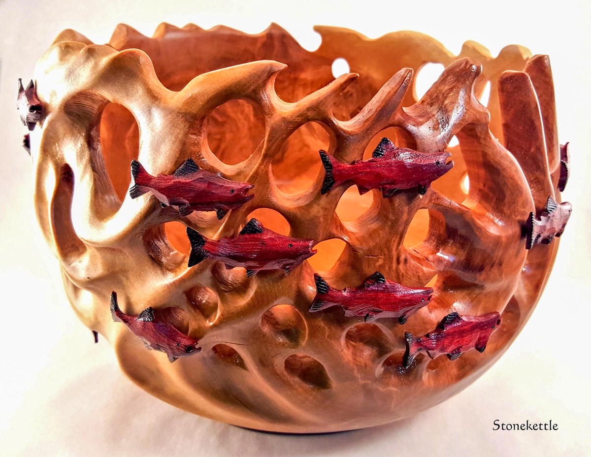For those asking about the wooden bowls I make and the artwork: I do stuff like this. Alaskan red salmon swimming upstream against the current.