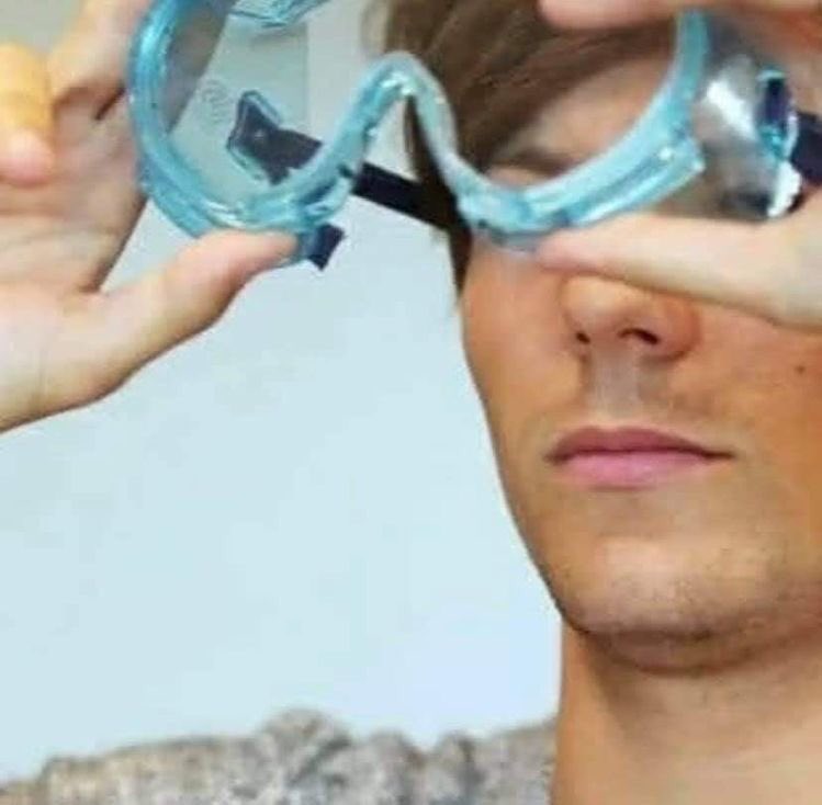 him putting his glasses on so he wont be squinting 