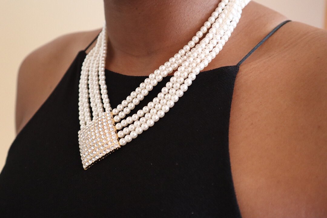 Take any simple top to the next level with this Pearl Rhinestone Necklace, Earrings and Ring. Wear them together or on their own. This set has you covered for any occasion!
