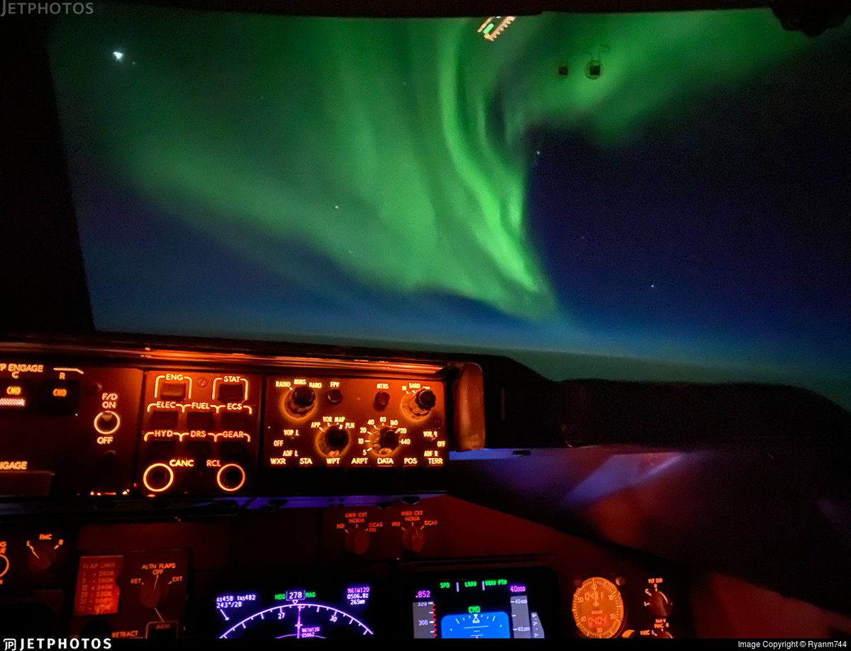 The Northern Lights dance above Canada outside the windscreen of a National Airlines 747. jetphotos.com/photo/10142335 © Ryanm744