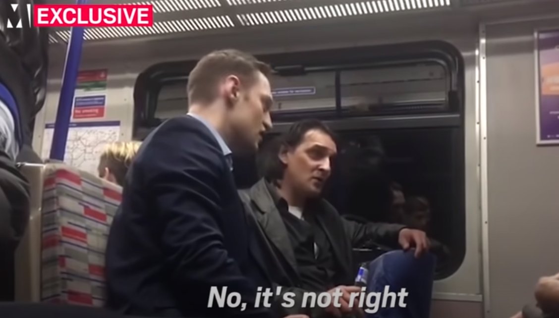 here's where it heats up: both of them turn to the young, sort of liberal-looking woman across from them to plead their case.it's Drinking on the Train vs. Racism, which will bother her more?