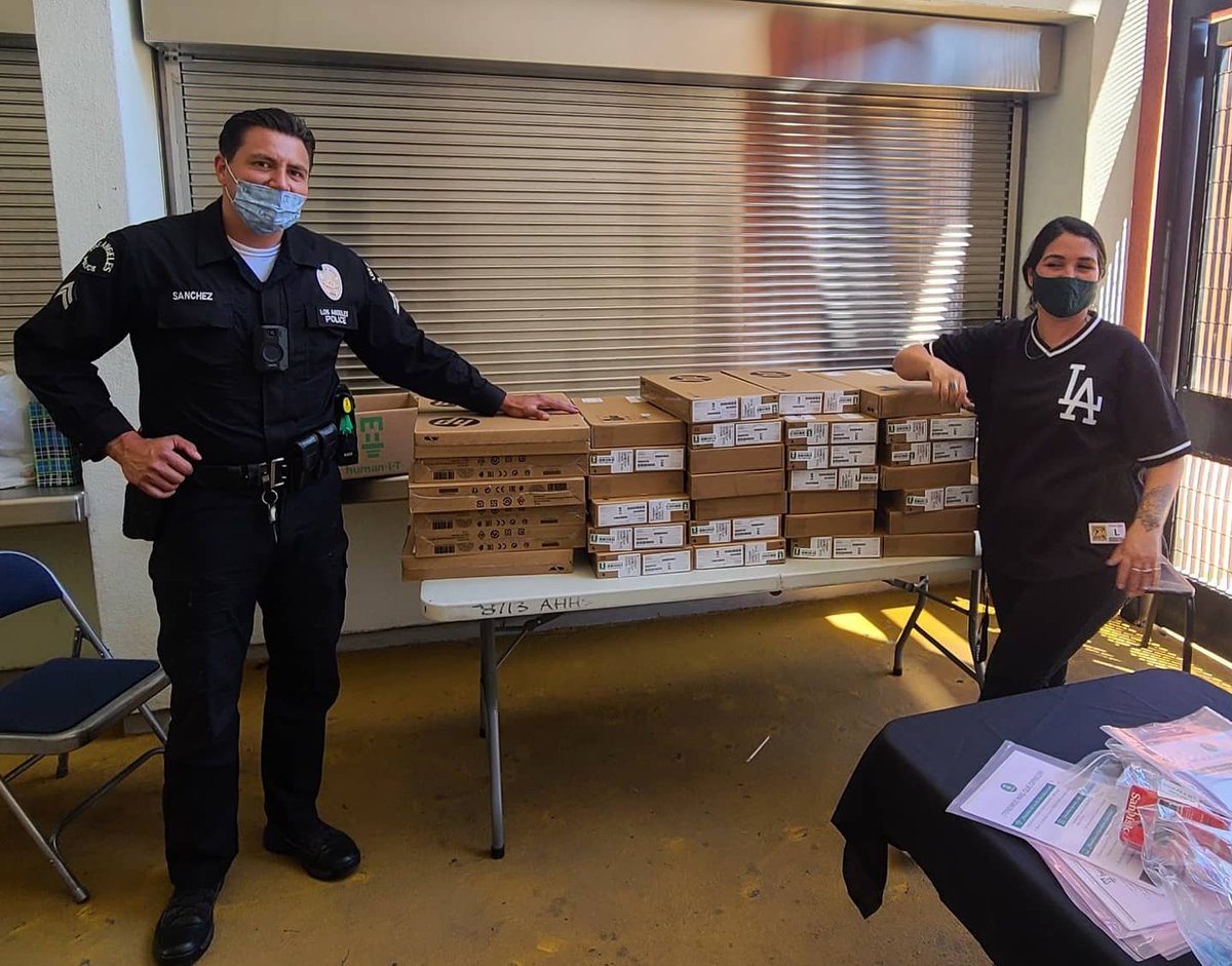 Computer giveaway at Augustus high school with Vice principal Ace, Council District-8 member Isiahs and Harvard Park CSP officers.