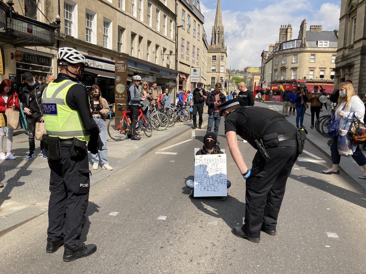 Extinction Rebellion Youth activist CJ took action in #Bath this morning acting as an individual blocking a key road in the city centre, and demanding that the Government takes the urgent steps required to avoid climate breakdown.

#RebellionOfOne #ClimateEmergency #KillTheBill