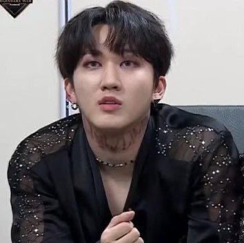 The words written on changbin’s neck:EVIL WON - They are the evils who fought with the angels and won. Their sacrifice of their lives was the victory of their fight.NOW LIVE - Their words to the boy. Now you are alive again, so “now live”.