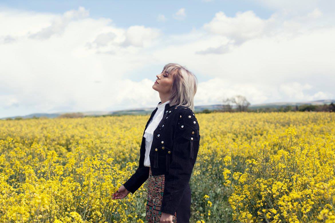 Ladytron singer Helen Marnie standing about in oilseed rape, and apparently getting high just from touching a bit of it. Hang on, maybe that explains this whole phenomena? 7/10