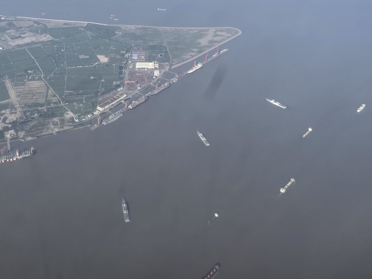 China Navy East Sea Fleet one type 075 LHD and three type 071 LPD in the Yangtze river estuary