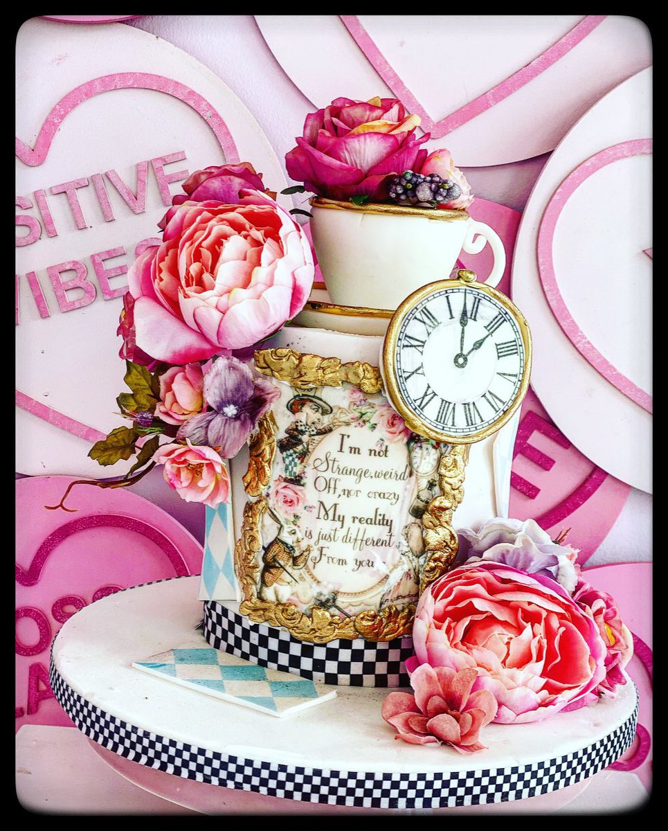 An Alice in wonderland inspired cake for a baby shower today