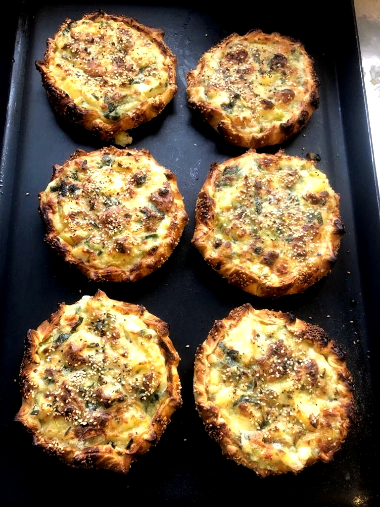 Leek potato and goats cheese tarts. A substantial main course tart made by mixing a fairly stiff Mornay sauce with sweated leeks, cooked potato and crumbled goats cheese. Inspired by those open peach cobbler type of tarts that they do in the States. Yum!!