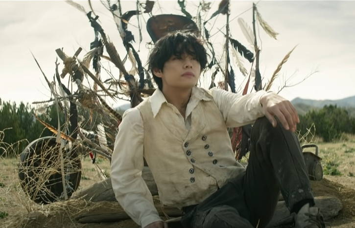 Tae on the other hand is laying on the ground. Notice how the shape of his body resembles crucifixion, with the spears & feathers behind his head symbolizing Jesus's Crown of Thorns. Tae is a representation of the Savior & this scene is foreshadowing Jesus's death on the cross.