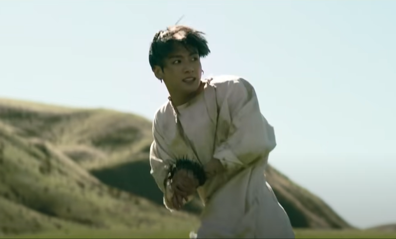 Next, we see JK running away, thorns tying up his wrists. In the Bible, thorns and shackles represent sin. So this scene symbolizes Jungkook/mankind trying to run away from sin and temptation. But unfortunately, he falls. JK's fall is a metaphor for the fall of the human race.