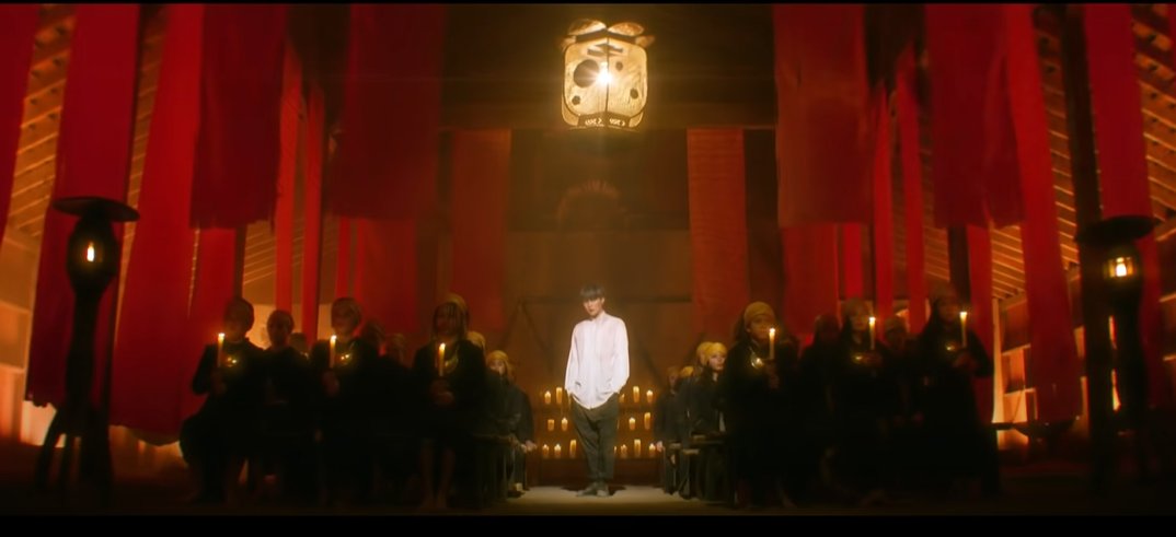 Yoongi is also a modern-day person from the future. He's in a Biblical times temple, not physically, but in spirit, through reading the Bible. The ppl in the pews symbolize God's people of all nations worshipping together. In the timeline of this MV, Jesus hasn't been born yet.