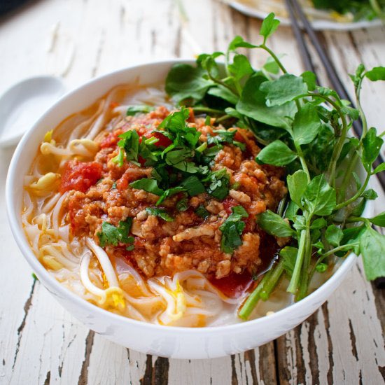 it’s rice noodle soup with soybean-tomato meat sauce, topped off with cilantro, spinach, scallion, etc.
