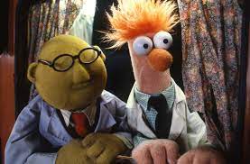DR. BUNSEN HONEYDEW AND BEAKER as SARUMAN AND GRIMA WORMTONGUEEngaged in important ring-related research.
