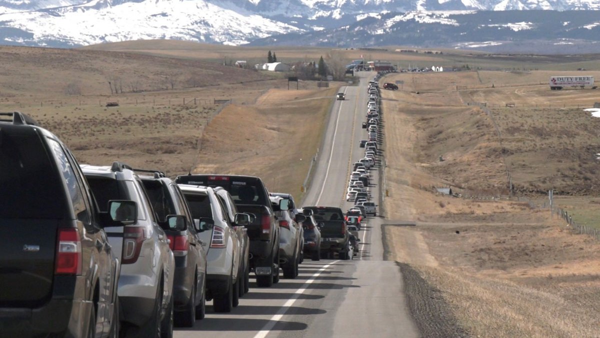 The Blackfeet Nation in Montana gifted their surplus COVID-19 vaccines (750 doses) to nearby residents in Alberta, Canada. People drove for hours and lined up for miles on the highway to be vaccinated at a mobile clinic set up at the border crossing.