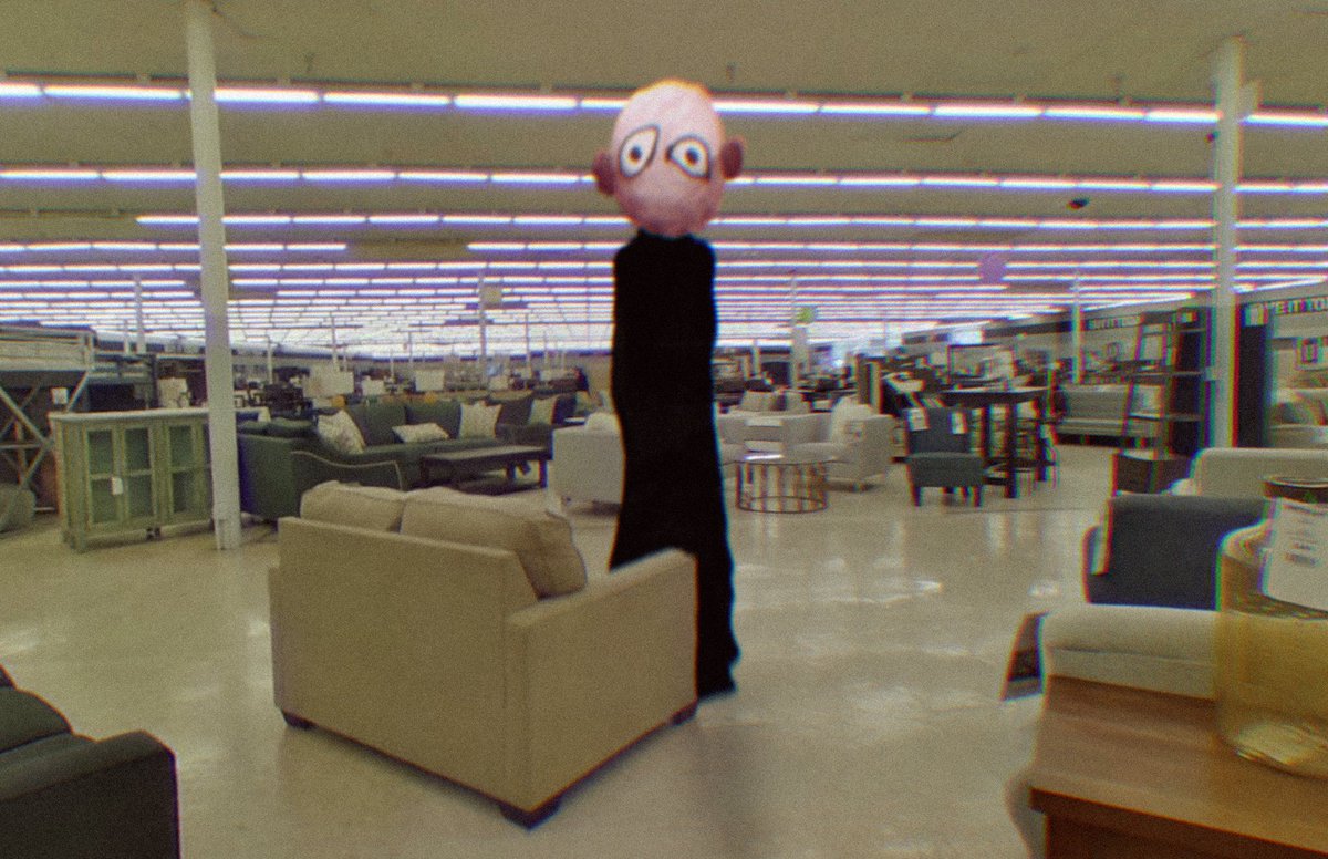 Followed by a stranger in the empty discount furniture warehouse