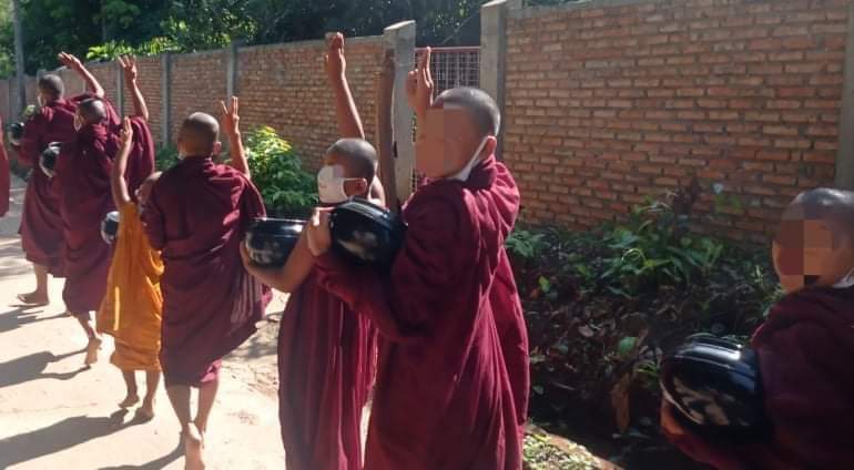 1311revolution's tweet photo. Earlier this morning, some monks in Mawlamyine City, Mon State took to the streets in protest, raising three fingers. 

#May3Coup #WhatsHappeningInMyanmar https://t.co/osL5zGdjV1