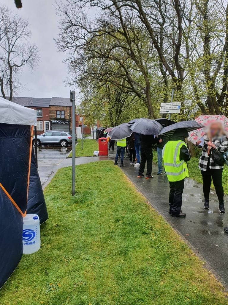 boltongpfed's tweet photo. Despite the rain, there is a warm welcome and people are still turning out for their vaccine at Queen’s Park today.  The bus is there until 4pm.
#Bolton #COVIDVaccinations https://t.co/t4NQ5uRl8h