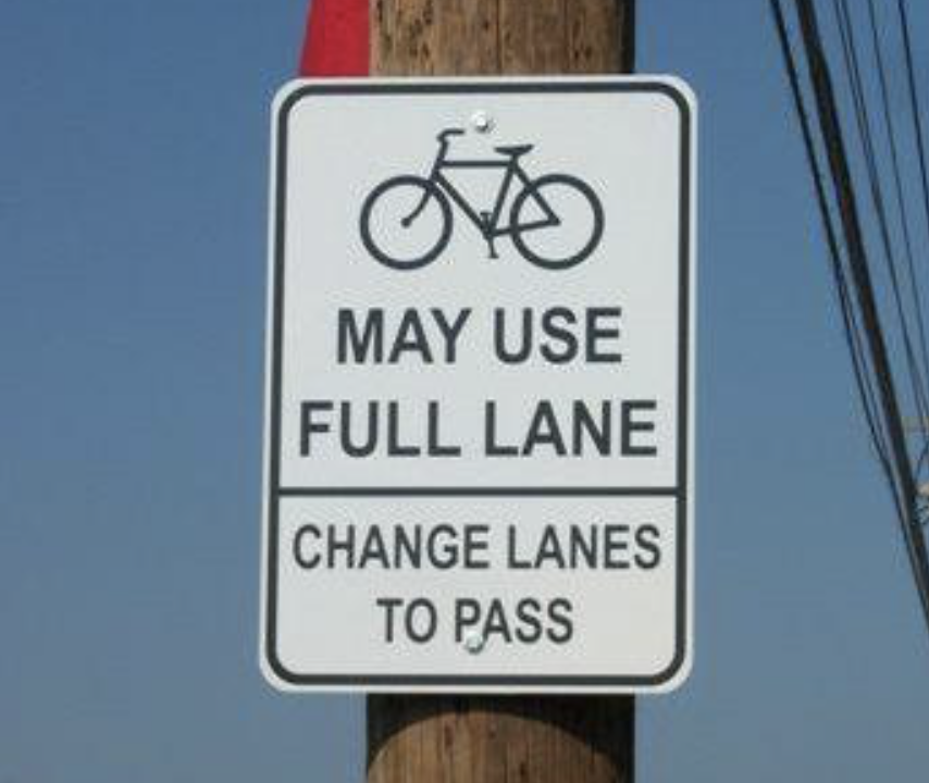 Pflax1's tweet photo. Share the Road signs are dumb. Sharrows are even dumber. Drivers don't understand them and they do a poor job of articulating simple rules. The sign below is WAY better. But ask yourself: Why do drivers who obsess over naughty riders need signs that just articulate existing law? https://t.co/sENM1PZW89