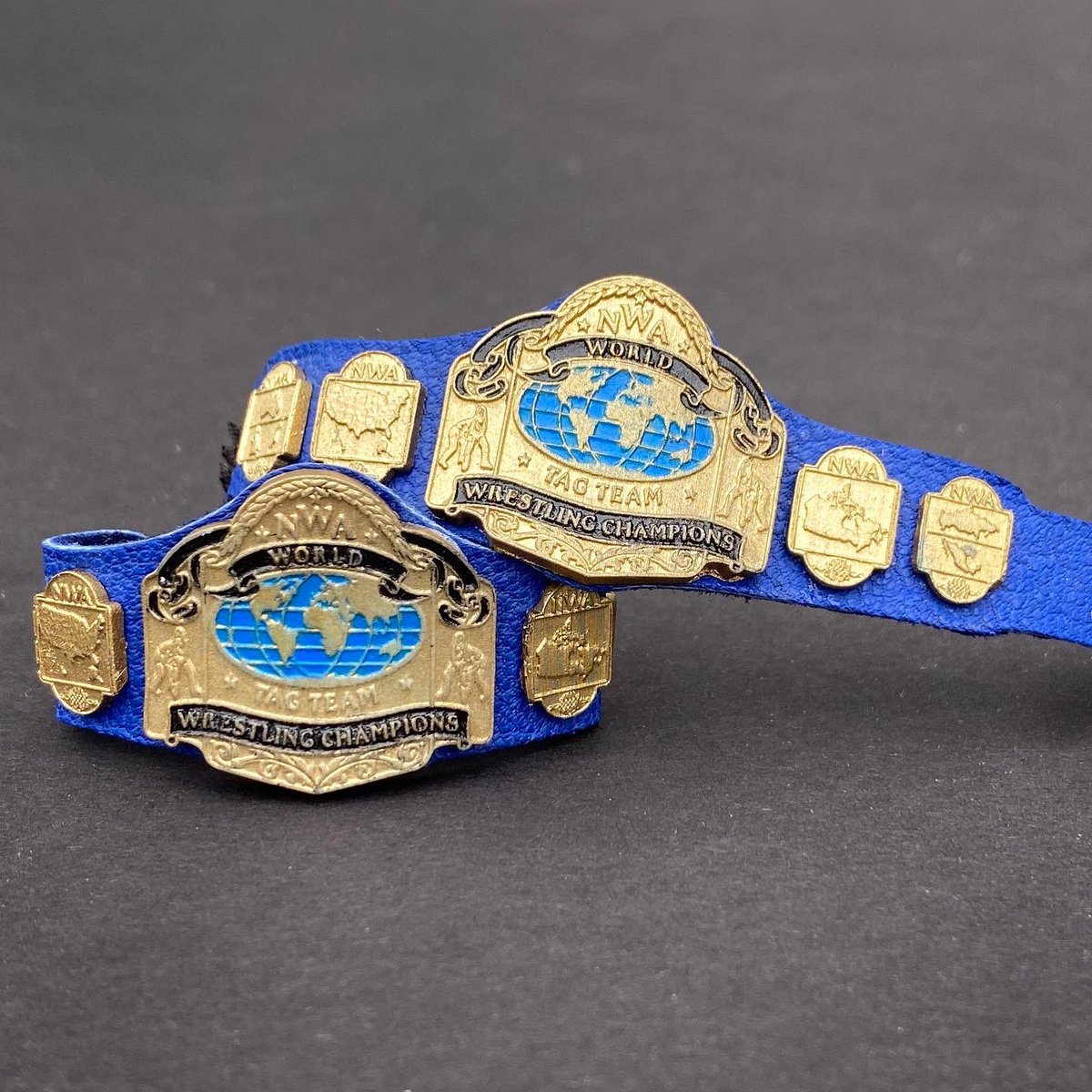 My newest custom belt creation: NWA Tag Team Championships circa mid-80s! I’ll have 5 sets on blue leather available to purchase on Friday.  #WWEEliteSquad #championshipbelts