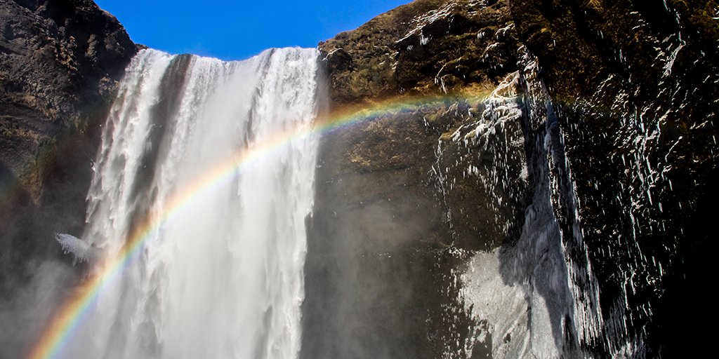 At Skógafoss in the south of Iceland, an 80-foot-wide wall of water drops 200 feet. Its mist regularly seeds rainbows like this one captured by Ashley Wilson. 

<a href="/MensaBulletin/">Mensa Bulletin</a> #OpeningShots