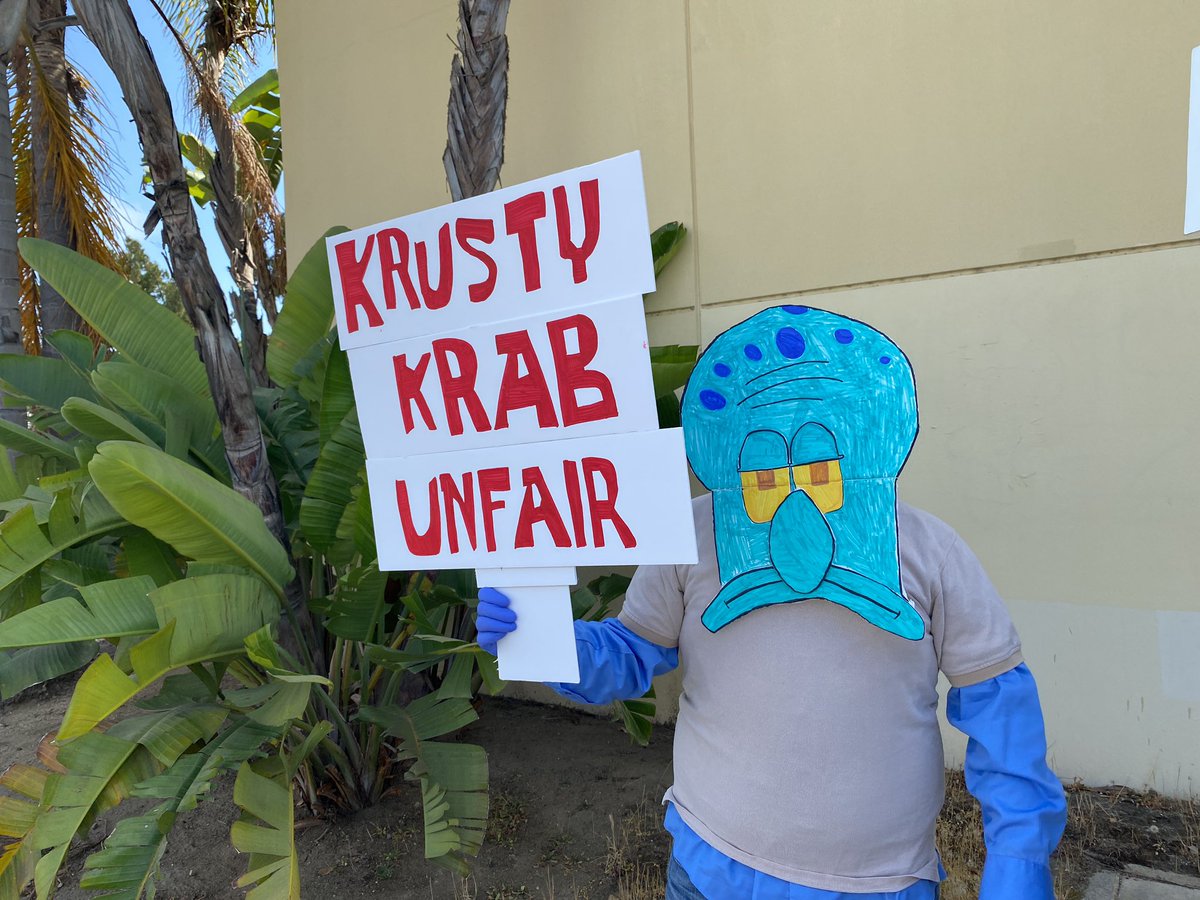 “Krusty Krab Unfair” and “Valet Parking” among the counter protesters’ signs