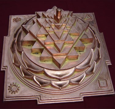 now, another interest of Grant's is "Sri Vidya, or “Holy Knowledge.” It is an important Tantric sect whose main feature is the three-dimensional Sri Meru Chakra (a form of the Sri Yantra), and the worship of the youthful goddess Lalita Tripurasundari."