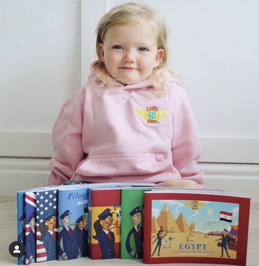 LetsGoSee1's tweet photo. Olivia showing off her Let’s Go See collection and hoodie! #letsgosee #aviation #education #travel https://t.co/xke6ojRitJ