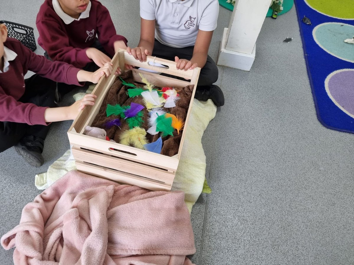 FoxHill_Primary's tweet image. This morning Reception discovered that Mummy Dinosaur had lost her egg! They made a special nest for the dinosaur egg with soft blankets, a teddy for company and a book to read when it hatches. Can you spot Mummy Dinosaur in the picture?