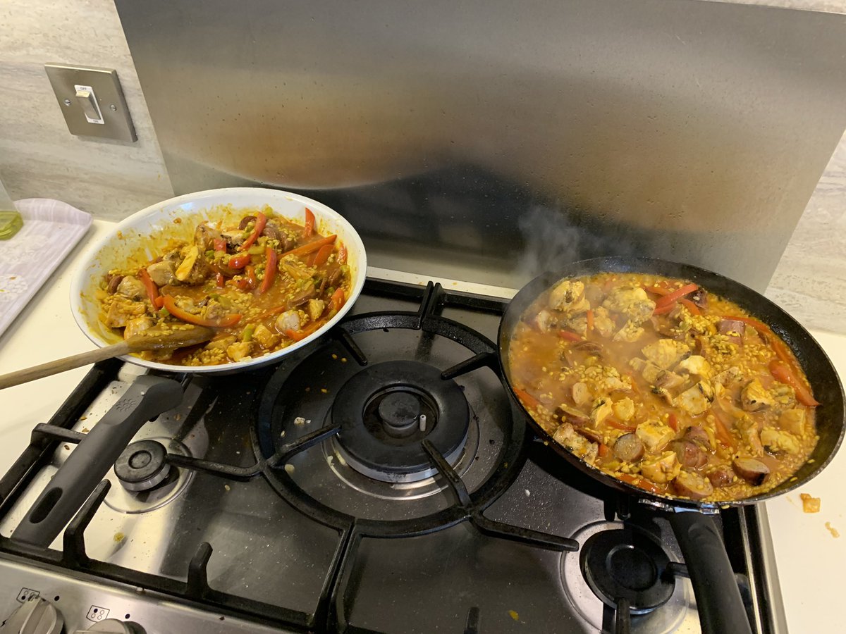 Spells95's tweet photo. When there isnโt a pan big enough for what you want, so you decide the best solution is just to make 2 paellas #Improvisation #Paella #BestDinner #GetInMyBelly #Holiday https://t.co/vghuBHKcuw