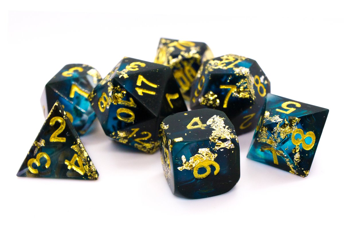 Handmade resin dice in dark blue and black with gold leaf foil and gold ink, tiny air bubbles inside some of the dice if you watch very carefully --> 65 Euro excluding shipping.