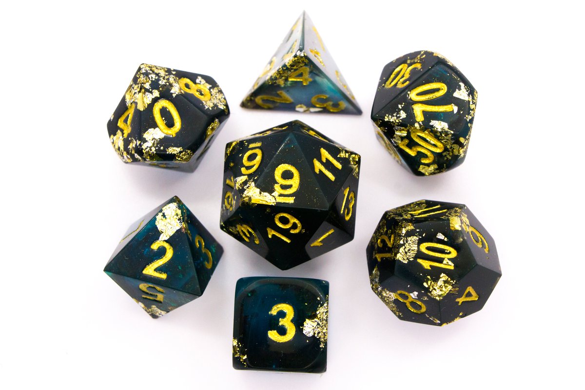 Handmade resin dice in dark blue and black with gold leaf foil and gold ink, tiny air bubbles inside some of the dice if you watch very carefully --> 65 Euro excluding shipping.