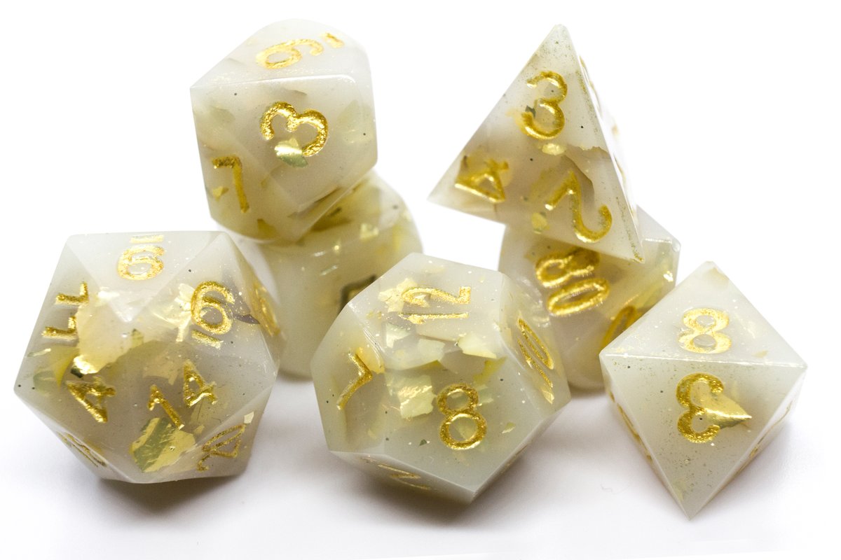 Handmade resin dice in a milky shade of white with gold leaf foil and gold ink, very minor flaws on some of the facets that face the lid --> 50 Euro excluding shipping.