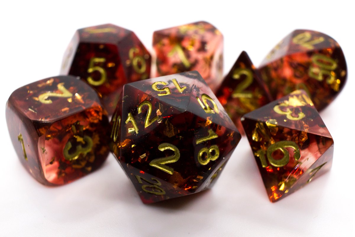 Handmade resin dice in dark red with gold leaf foil inside and gold ink, very minor flaws on some of the facets that face the lid --> 50 Euro excluding shipping.