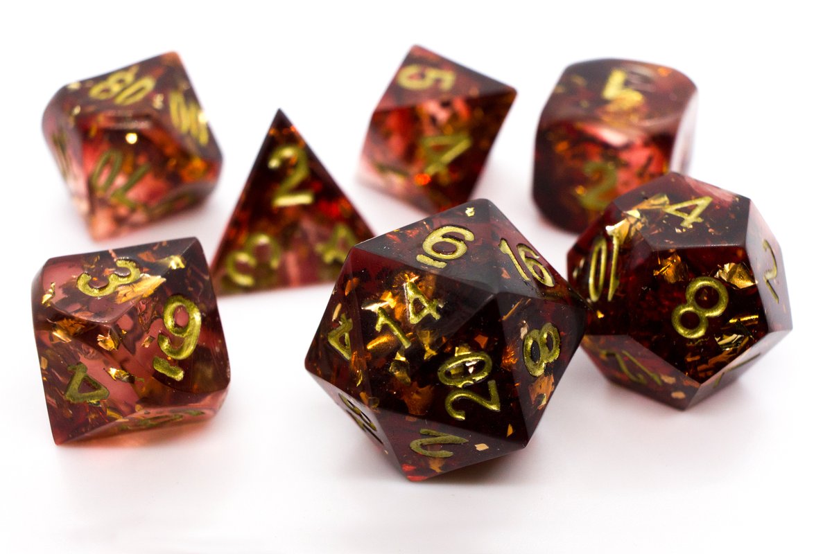 Handmade resin dice in dark red with gold leaf foil inside and gold ink, very minor flaws on some of the facets that face the lid --> 50 Euro excluding shipping.