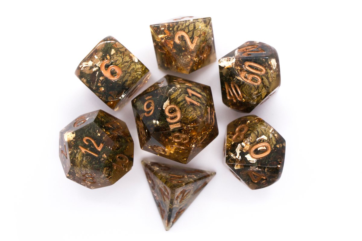 Handmade resin dice with mini pine cones, moss, copper leaf foil, glitter and copper ink. Minor flaws on some of the facets that face the lid and tiny air bubbles inside, but it's still a super pretty set --> 65 Euro excluding shipping.