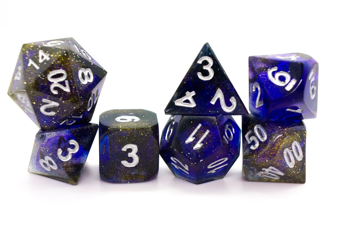 Handmade resin dice in dark blue with gold dust and silver ink, very minor flaws on some of the facets that face the lid --> 70 Euro excluding shipping.
