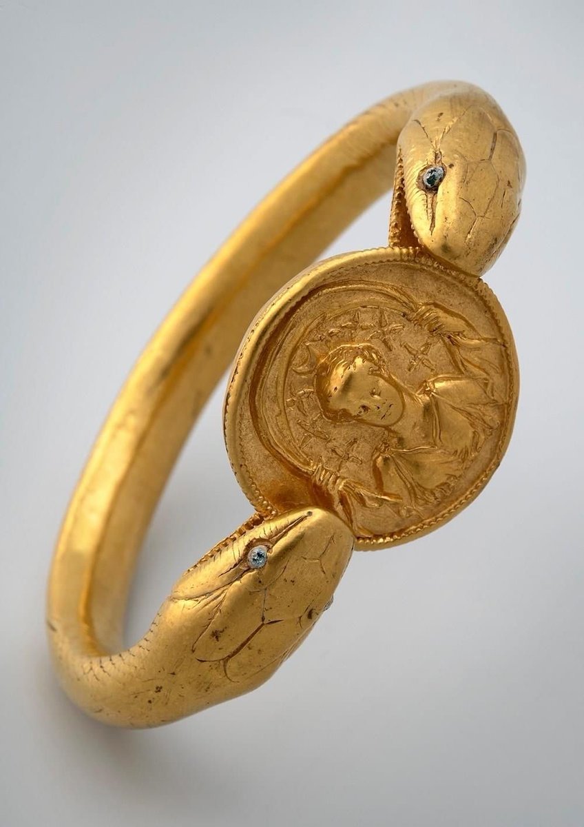 CARAA_Center's tweet image. Gold bracelet buried and found in the so-called &quot;House of the gold bracelet&quot; in Pompeii. 
A two-headed serpent forms the body of the bracelet, enclosing a portrait medallion, representing the goddess Selene, goddess of the Moon.
