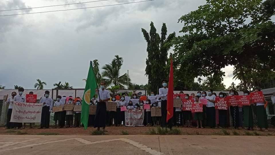 EiPont22's tweet photo. Students from Ottu Village, Thayet Chaung protest against military slavery education system and hanged red painted school uniforms on the fence of the school. #WhatsHappeningInMyanmar  #May6Coup  #OpposeSlaveryEducation https://t.co/KjJjsIoOVB