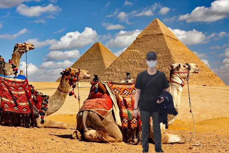 GREAT PYRAMID OF GIZA — He looks so small next to the Camels 