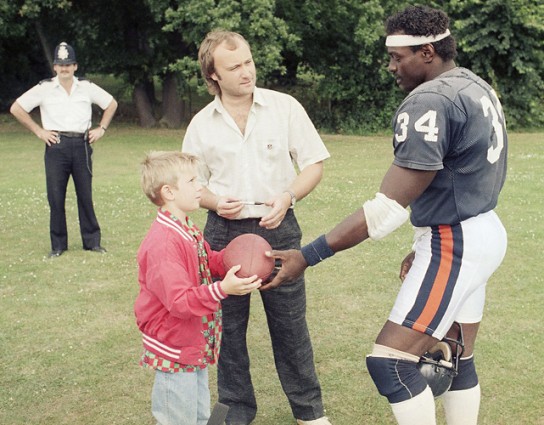 Every morning, I had to watch my heroes being fawned over by English people who could never love the Bears in way I loved them. Most galling were the shots of Phil Collins and his son hanging out with Walter Payton during training. I detested Phil Bloody Collins in that moment