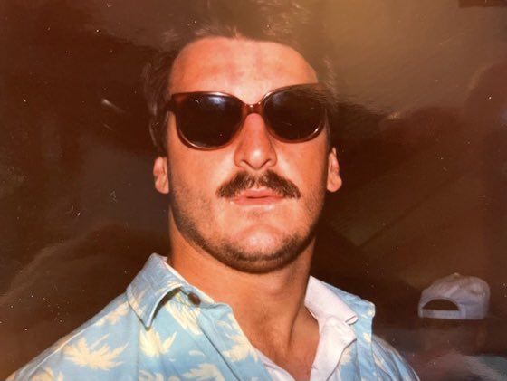 At 4 AM Bears groggily deplaned. Mike Ditka emerged from customs, with signature cigar, shouting “These men are your heroes, leave them alone.” Kurt Becker was in front of me. I asked if he'd take a photo with me. “Fuck off,” he said. So Plan B, I fired off my flash in his face
