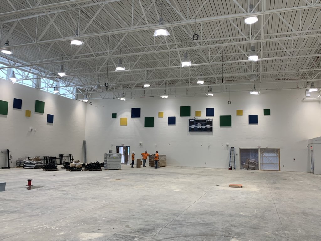 Our gym is taking shape... hardwood and bleachers in about 2 weeks! Scoreboard is up and we are winning!