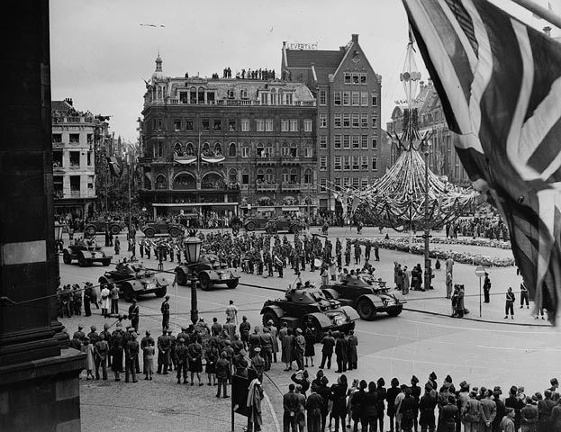 If it was not for the actions of Dutch Major Overhoff and German Hauptmann Bergmann in urging their respective countrymen to put down their arms, many more people may have died that day. On 8th May, British and Canadian forces entered the city.Photo: Amsterdam Parade, 28Jun45