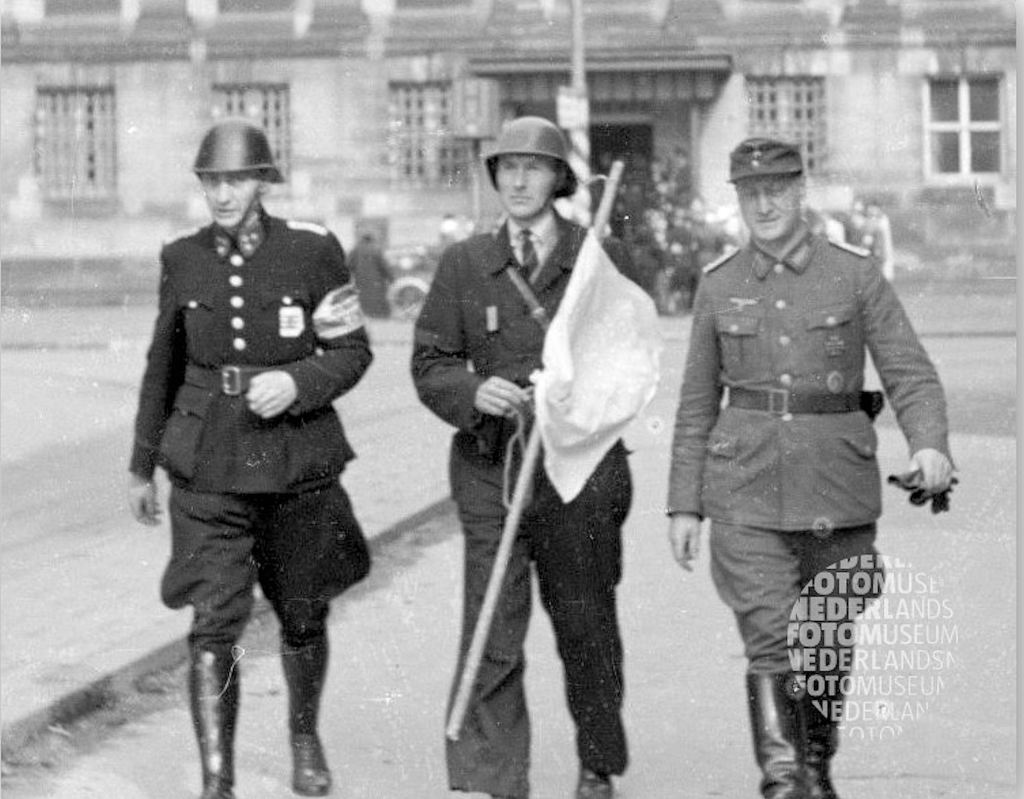 Dutch Major Overhoff, witnessing the incident, hurried to the German Ortskommandant (local commandant) for help. Hauptmann Bergmann of the Gendarmerie accompanied Overhoff back to Dam Square. Bergmann was not happy, stating ‘that is natural again of the damn marines, what a mess’