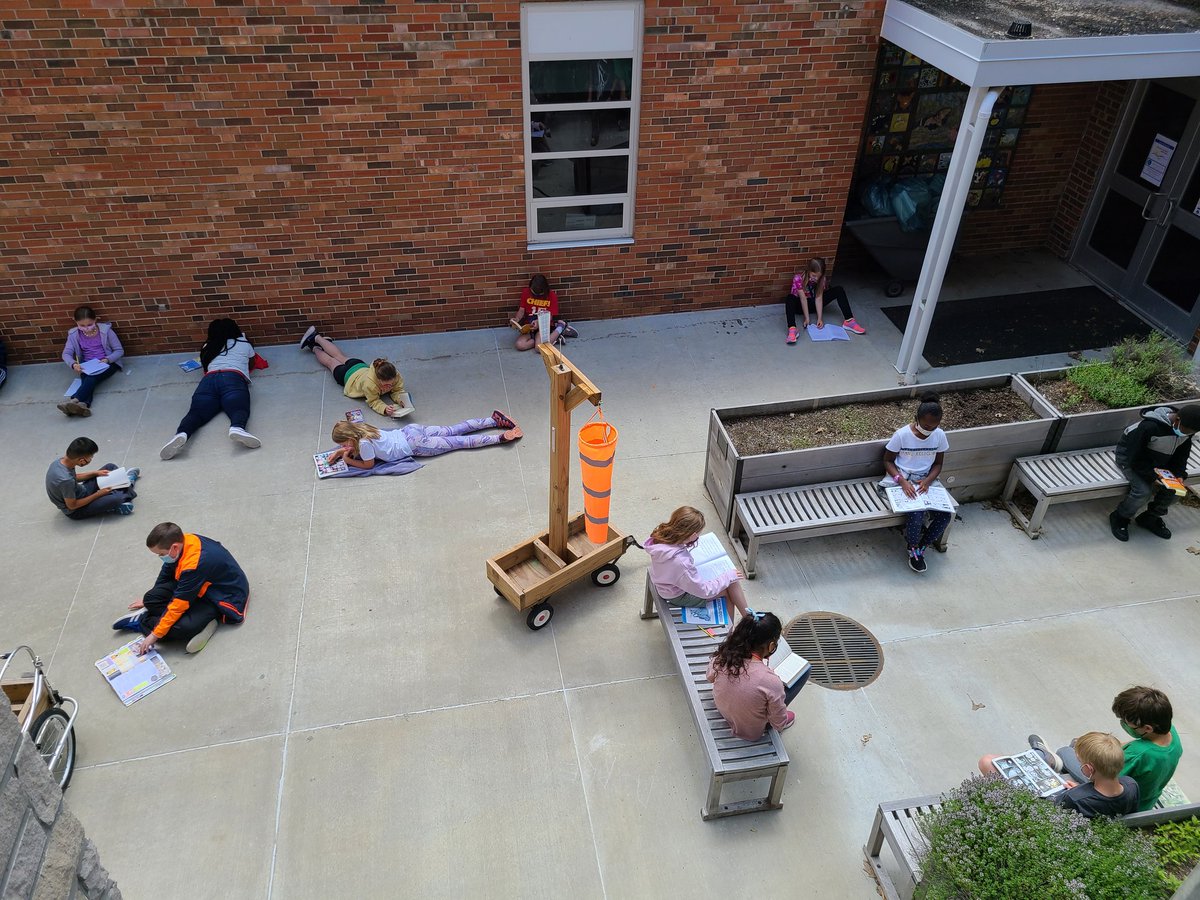 A gorgeous day means time outside for reading and writing stations!